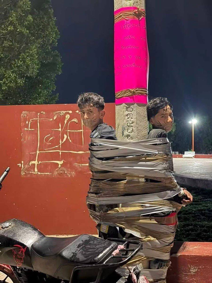 Alleged motorcycle thief duct-taped to a street pole in Lagos de Moreno, Jalisco