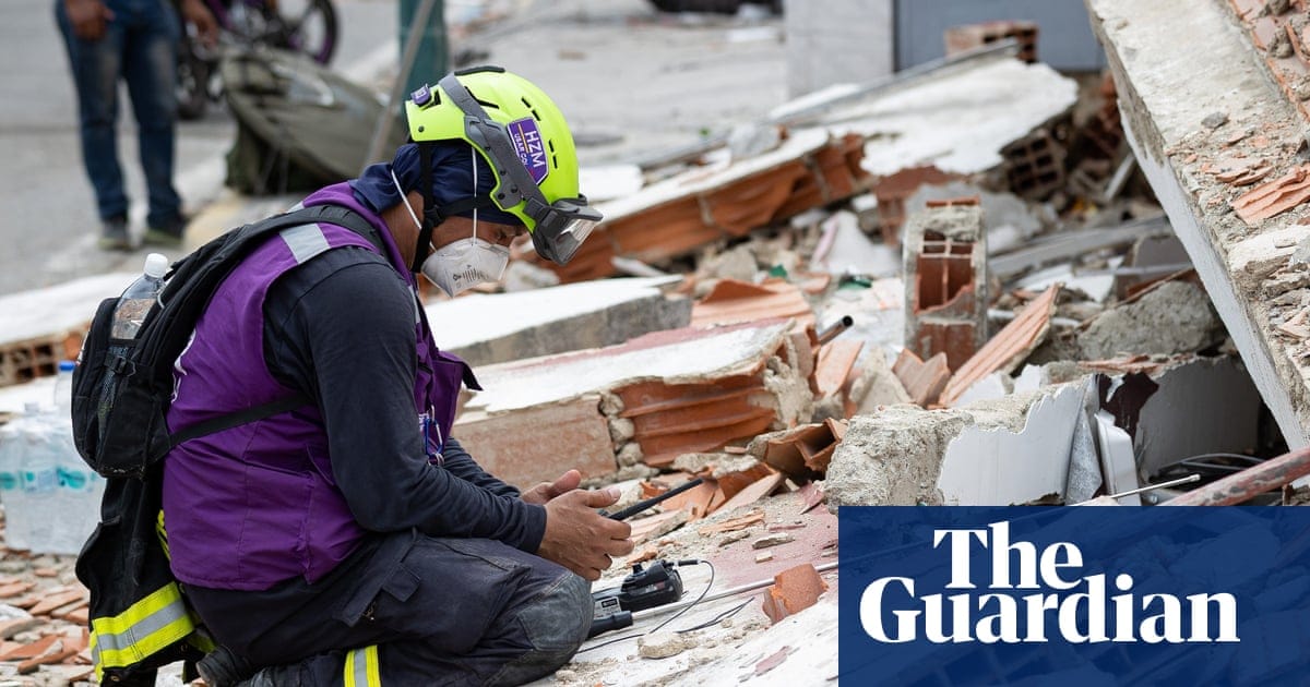 Rescue worker surveys the rubble in an area affected by the earthquake in Catia La Mar, Venezuela
